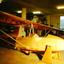 Stripped glider airframe in workshop undergoing repair