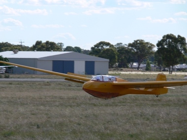 Yellow glider landing 