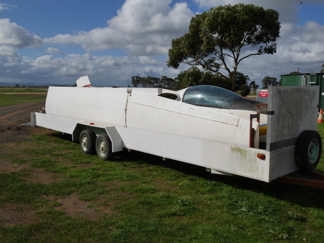 Derigged glider components on trailer
