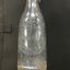 Close up of embosed label on cordial bottle. Reads Charlton Cordial Co Charlton