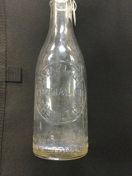Close up of embosed label on cordial bottle. Reads Charlton Cordial Co Charlton