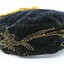 Closer view of the yellow beading on the side of the cap. Flower and leaf motif.