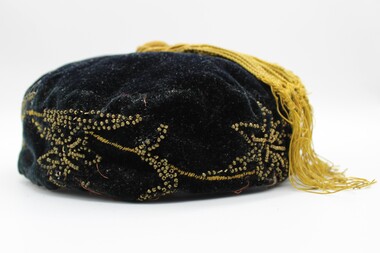 Smokers cap in deep blue and yellow beading with tassle on top.