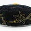 Closer view of the yellow beading on the front of the cap. Flower and leaf motif. This wraps around the brim of the cap