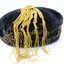 Smokers cap with the yellow tassel spread out over the cap showing the twisting of the strands.