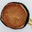 Inside lining of the smokers cap. Showing the stitching and gold coloured lining.