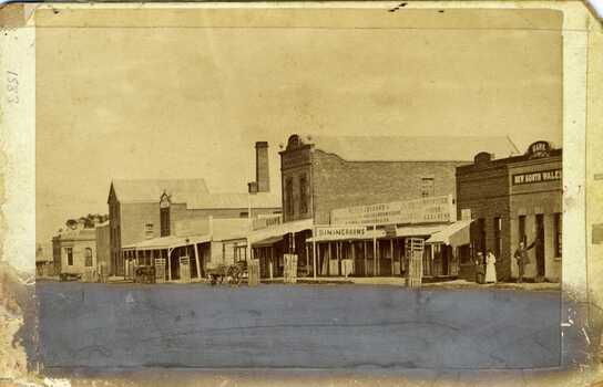 Looking down High Street, Charlton, The shops include the Bank of Victoria, Malcolm's Flour Mill, Procteas Butchers shop, Golden Fleece Hotel, Johnson's Bridge store, dinning room and bank of NSW,