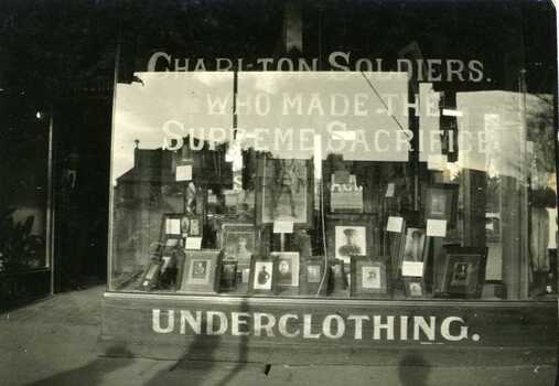 Wylies' store front window displaying photos of Charlton Soldiers. Sign in window reads "Charlton Soldiers who made the supreme sacrifice'