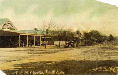Looking down High Street at the shops and buildings. Charlton Foundry sign on the first shop with horses and carriages out front.
