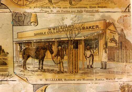  W. Williams Saddle Collar & Harness Maker. Three men in front of shop; one holding a horse, two in aprons. 