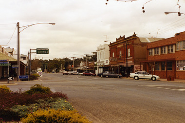 Looking down main street to war memorial. RH side are the Globe Hotel, Heather's Choice Gift Shop, Mallee Kitchen, Charlton Pharmacy, Westpac Bank. Bush Poet Cafe sign on LH.