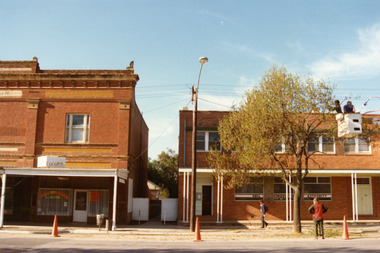 Café section,Two storey, red brick Dillon building. Signage reads CHARLTON BYO RESTAURANT ,MEALS, TAKE AWAYS, SNACKS, COFFEE, DRINKS.