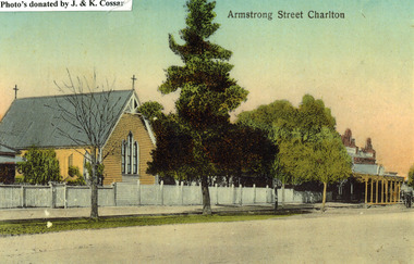 Church, Armstrong St, Charlton. A yellow, timber building with a cross at each end of the roof. A white picket fence runs along the front.