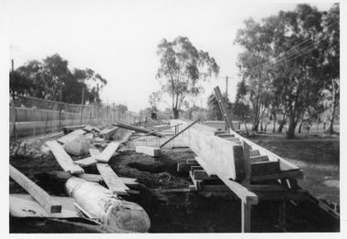Widen the James Paterson bridge. Construction timber and concrete forms litter the site.