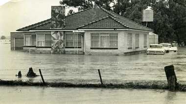 1973 Flood, W. Fitzpatrick's hause or Calder Hwy, surrounded by flood water from flooded Yeungroon Creek.
