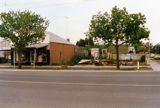 Building rubble piled on the corner of the street from the demolishion of 2 shops