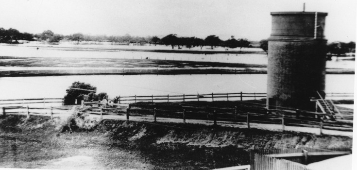 Railway dam & water tower Charlton Railway Station 1923. Surrounded by flood water.
