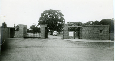 Heavy stone work gates leading to Charlton Park and oval. Two sets of gates for vehicles with foot traffic gates on the right.
