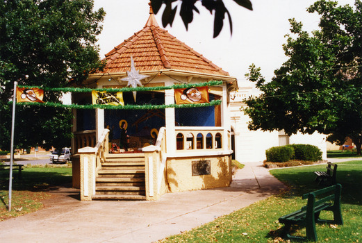 Band Rotunda in gardens. Red tiled roof and brick base.