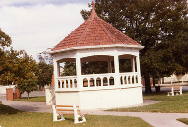 Brick band rotunda with red tiled roof.