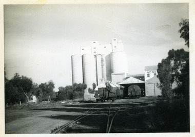View of Mill and Silos along the railway tracks.