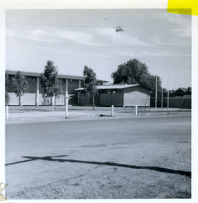 Front of brick buildings, one is the shire hall the other is the RSL club.