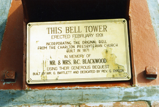 Close up of Bell Tower commemoration brass plaque.