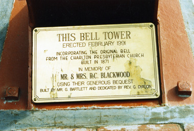 Close up of Bell Tower commemoration brass plaque.