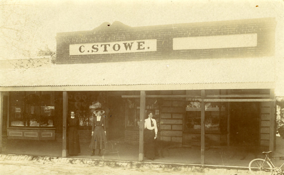 Shop front of C. Stowe shop (fruit and veg cafe) c.1900. Three women and bicycle in front.