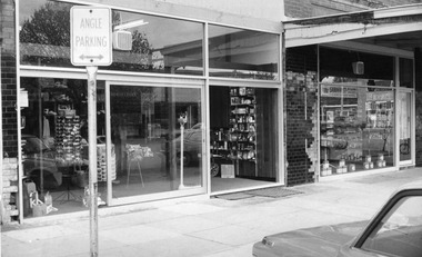 Street view of main display window for Pharmacy.