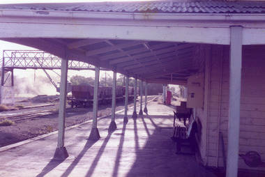 View along the station platform looking under the veranda. 
