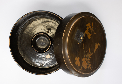 Wood, painted collar box. The lid open exposing the dark interior.