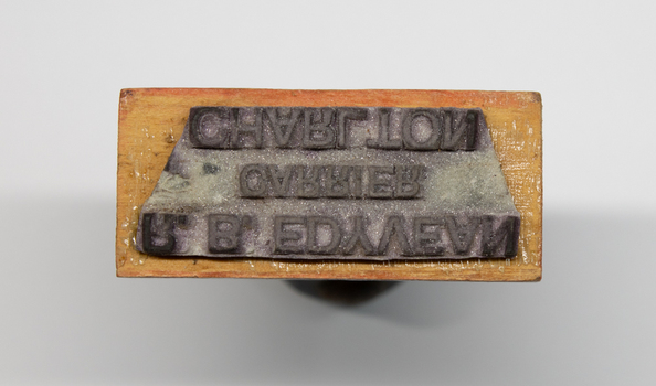 Base of stamp showing rubber lettering.