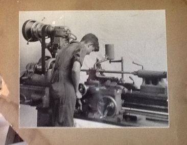 Photograph - Collingwood Technical School, Collingwood Technical School. Unemployed youth training scheme 1938-1940. Trainee engaged in cutting the screw thread on saddle traversing screw of 5 inch centre lathe