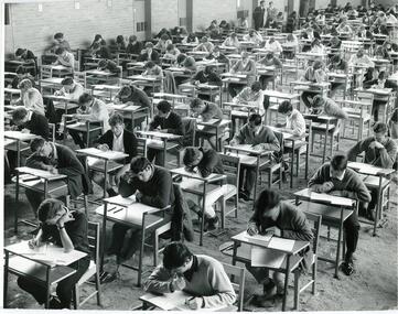 Photograph: PCOT students sitting exam in gym c1980s, Photograph: Preston College of TAFE students sitting exam in gym c1980s