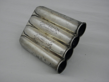 Cigar holder awarded as trophy to Harry Jenkins with inscription Motorcycle Club of NSW Scratch Race 16-2-10. Made from silver and holds 4 cigars.