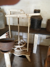 photograph of cheese press in situ