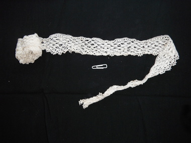 section of partially rolled lace trim