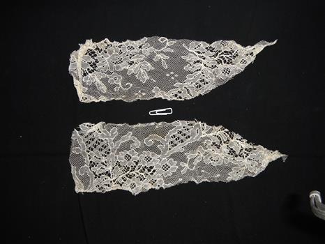 two pieces of lace with intricate patterns