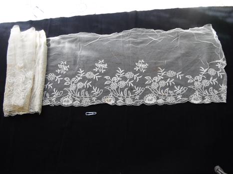 section of lace trim on black