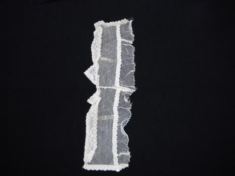 photograph of a white lace collar