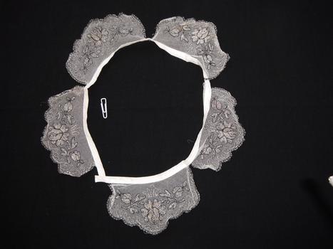 lace collar on black background