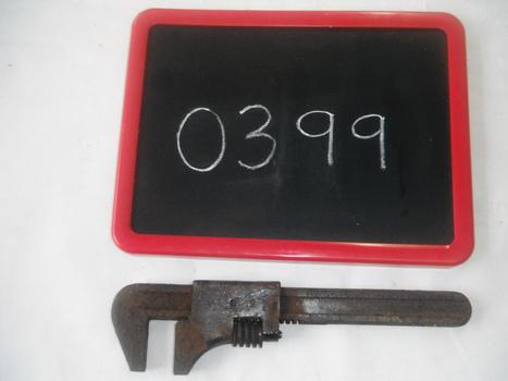 pipe wrench with blackboard on white sheet