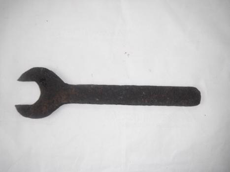 detail photograph of spanner on white sheet