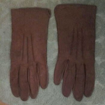 Pair of light brown ladies gloves.