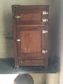 A hardwood two door ice chest