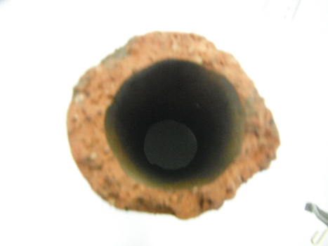 a deteriorateed terracotta pipe 15cm