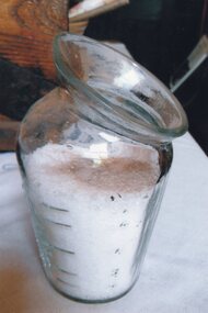 measuring glass filled with salt