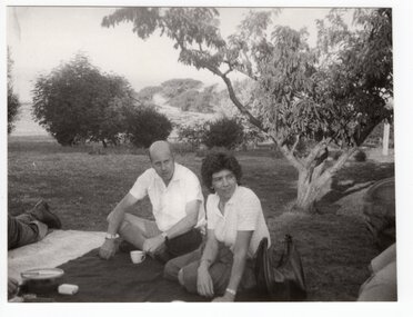 Photograph of two people at a picnic, <1975