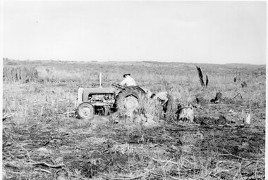 Photograph of man on a tractor, Unknown